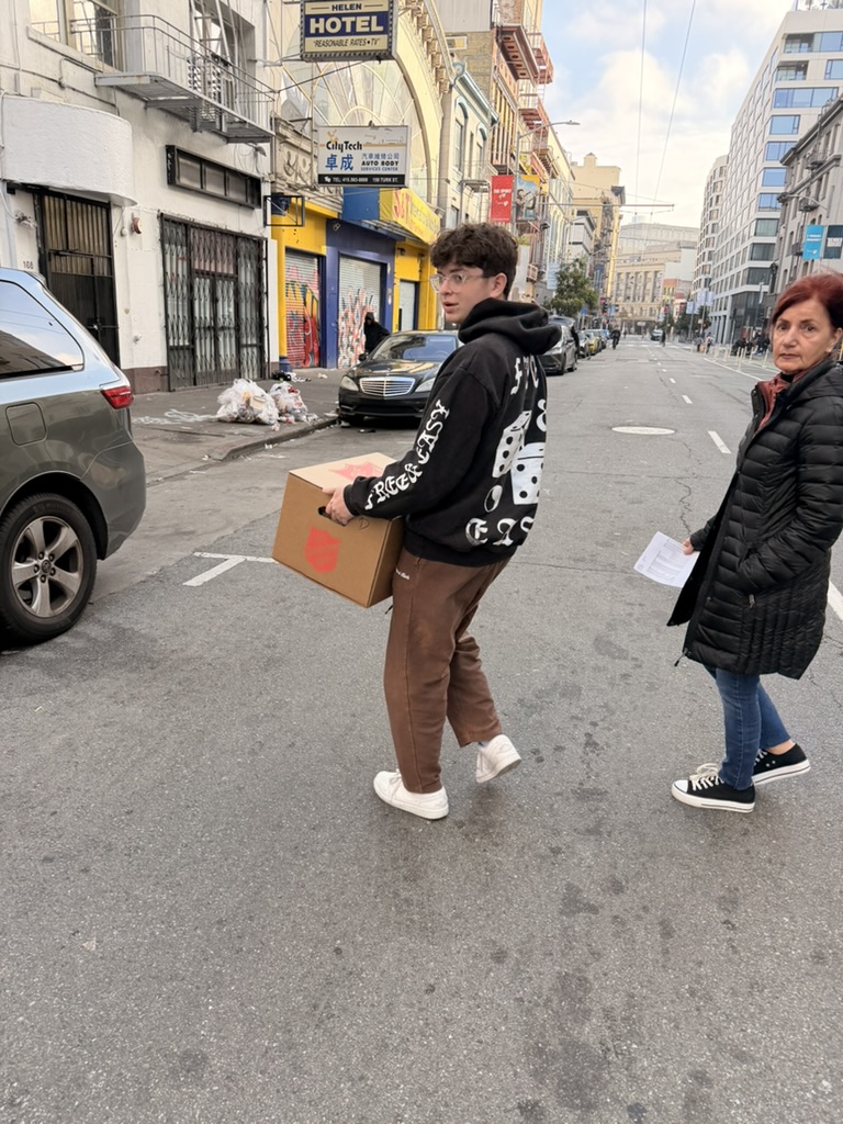 Julien delivering Thanksgiving meals in SF Tenderloin